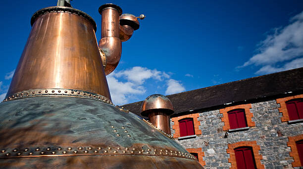 Whisky distillery stills in Ireland near Midleton Distillery. Image via Jameson/ Pernod Ricard