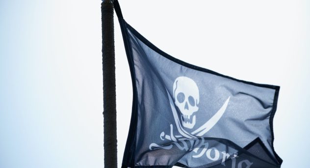 Yo-Ho! Pirate-Themed Event Pouring Rum to Raise Money for Charity - Jolly Roger flying in the wind