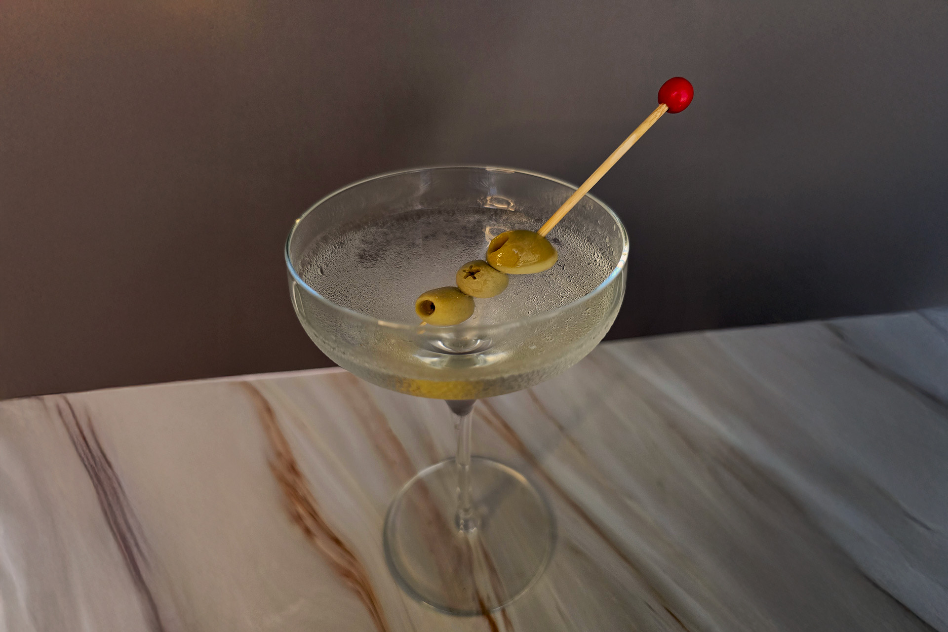 dirty martini with 3 olives garnish