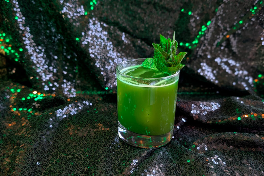 green wicked-themed cocktail