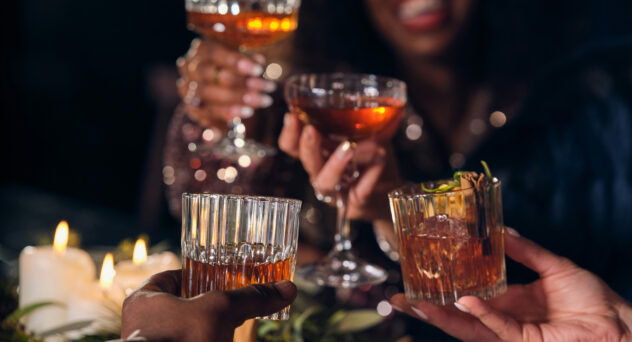 group of people, dinner party, holiday, raising glasses, cocktails, old fashioned cocktails